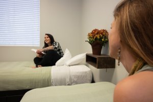 two young women sharing a bedroom