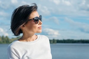 Woman enjoying the wether of at her women's detox center in Florida