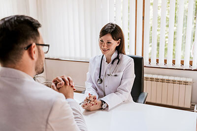 doctor tells patient about therapy services