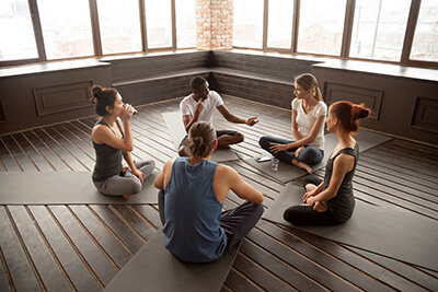 people participating in a yoga therapy program