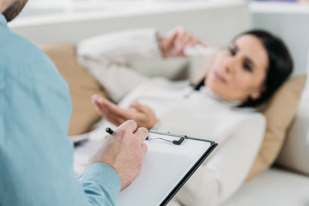 what is psychotherapy woman talking to therapist asking what is psychotherapy