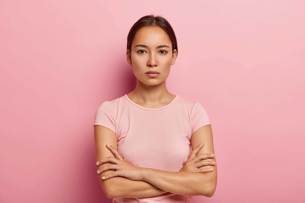 opioid vs opiate woman wearing pink against pink wall opioid vs opiate