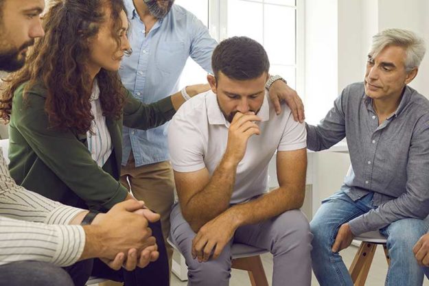 A group of people helping a loved one detox