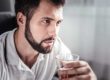 Man pondering whether there's a connection between anxiety and alcohol