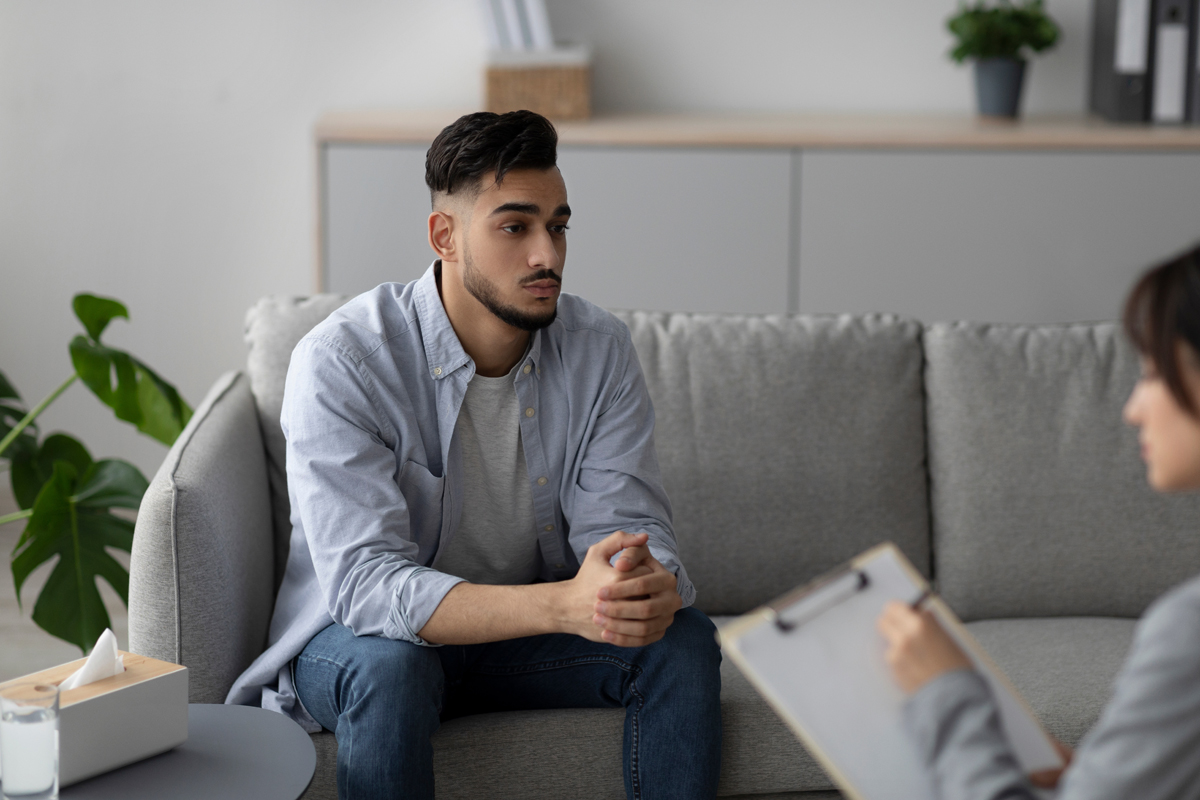 Man sitting on couch in counseling session