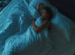 Woman sleeping in bed