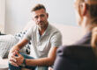 Man talking to therapist about recovery