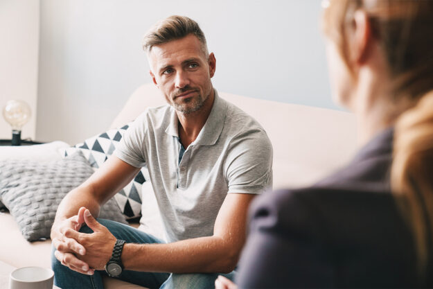 Man talking to therapist about recovery