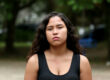 Woman serious portrait outdoors