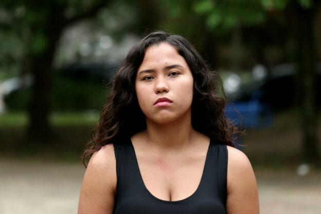 Woman serious portrait outdoors