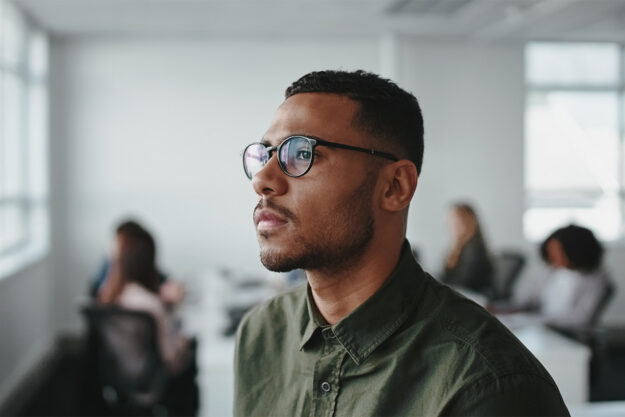 What Is Kratom Effects, Risks, and Signs of Dependence Image 1 Man with glasses looking off into the distance thinking